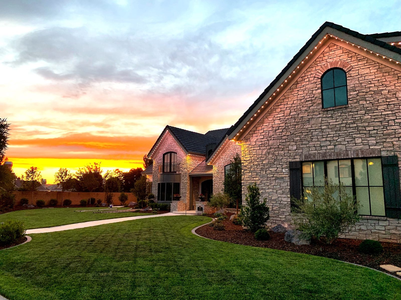 Home with permanent LED track lighting at dusk